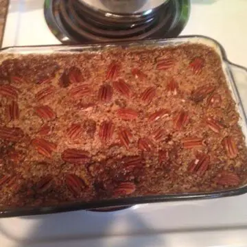 A pan of pecan cobller decorated with tasty half pecan