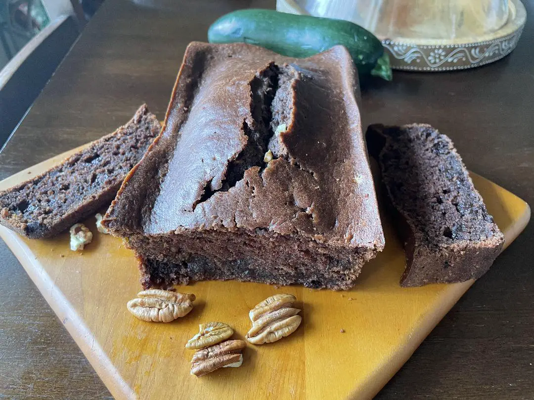 Moist and Delicious Double Chocolate Zucchini Bread garnished with walnuts