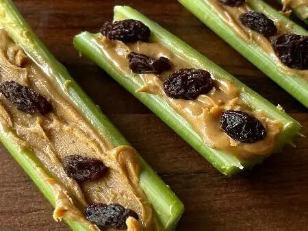 Celery sticks filled with delicious peanut butter and topped with raisins.