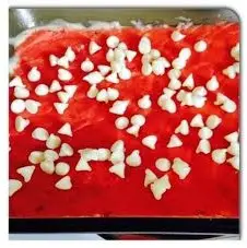 The white chocolate chips on the top of strawberry cake mix will melt with the cream cheese. You will get a mouthwatering taste that you will never forget.