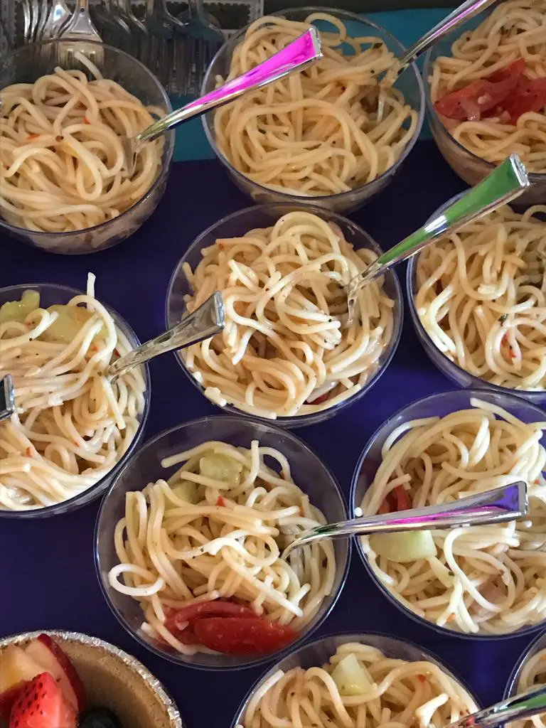 Summer pasta salad served in small bowls ready to be enjoyed in family gatherings. 