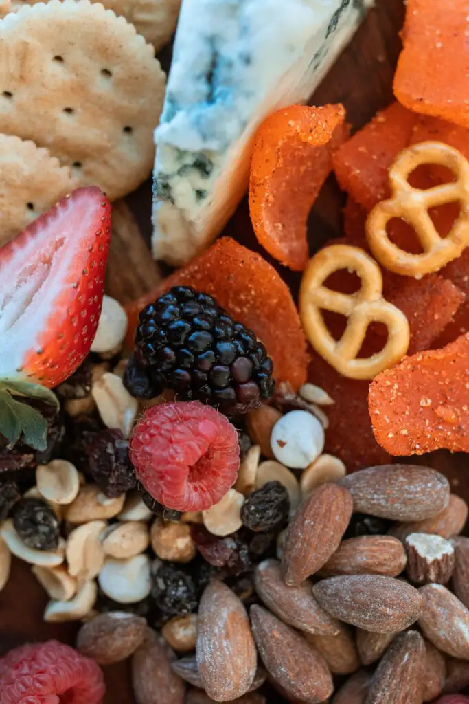 sample charcuterie board with dried fruits, nuts, and pretzels