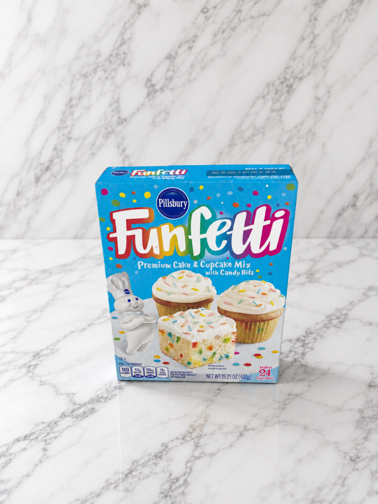 Pillsbury Funfetti premium cake mix box on a white marble background for box cake mix baking inspiration.